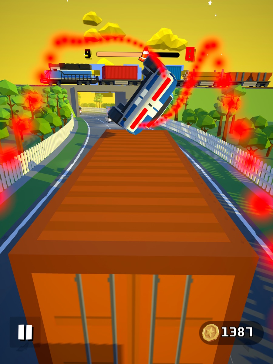 Car suspended above an orange freight container near a railway bridge